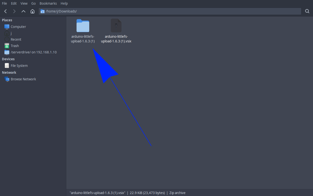Downloads folder showing the unzipped folder alongside the .vsix file